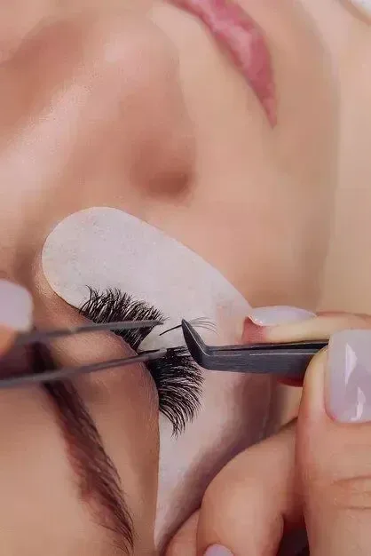 Close-up of a lash extension treatment in progress