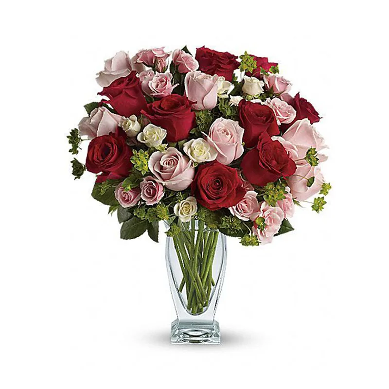 Red and pink roses arranged in a glass vase