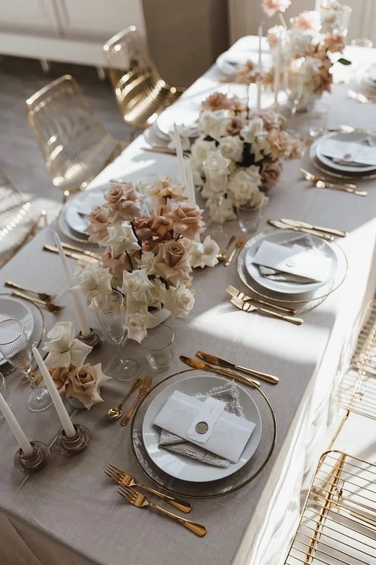 Refined tablescape with blush roses and gold cutlery