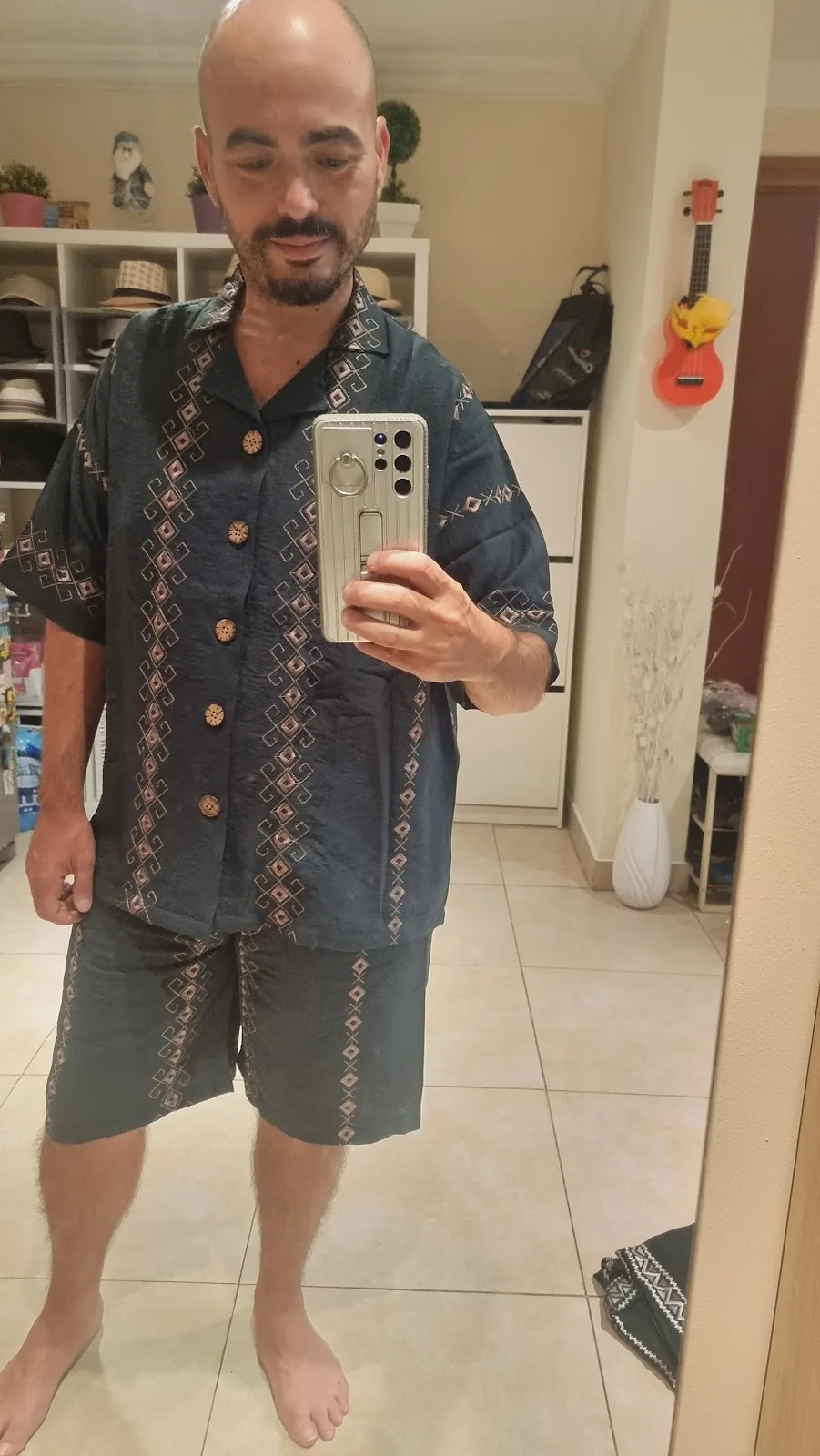 Navy patterned short-sleeve shirt and shorts set with carved buttons.