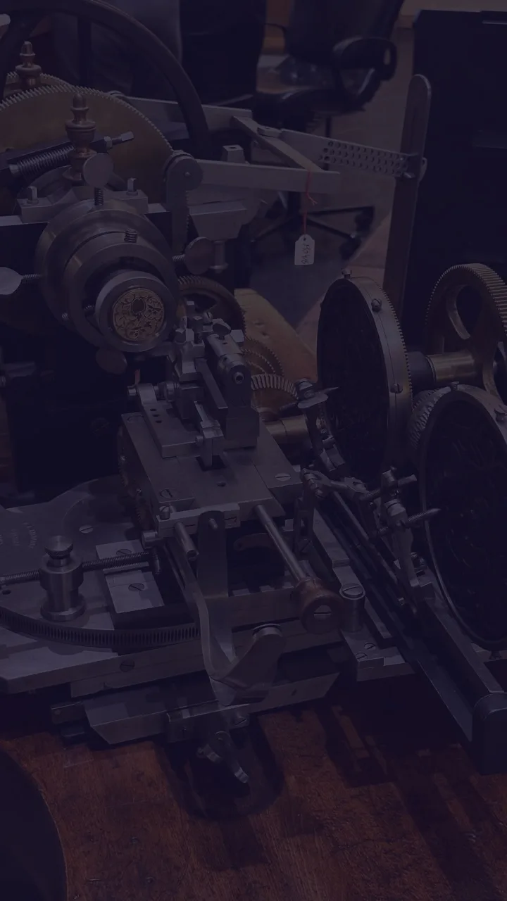 Close detail of clock movement components in the workshop