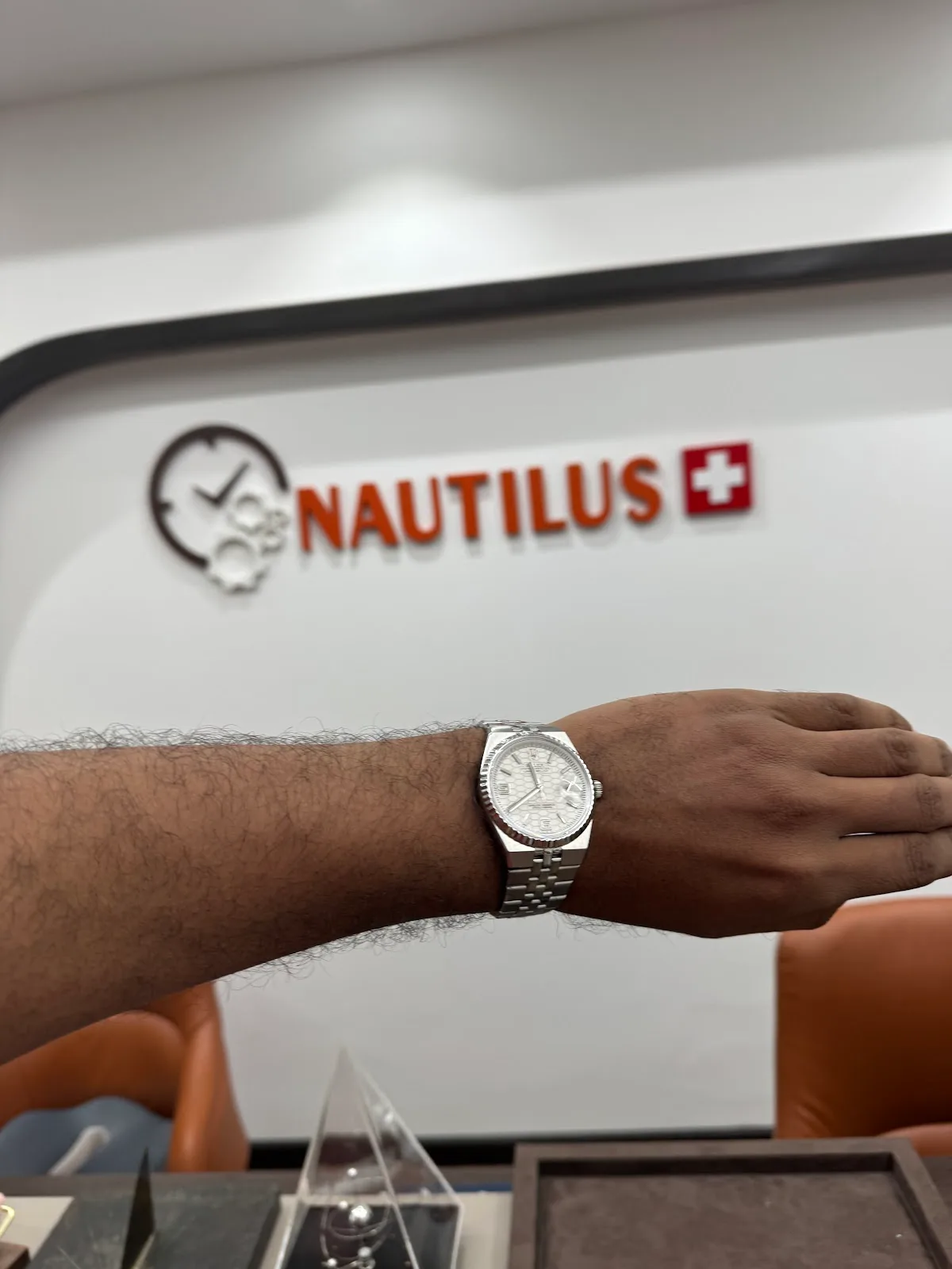 Nautilus showroom interior with the brand wall sign