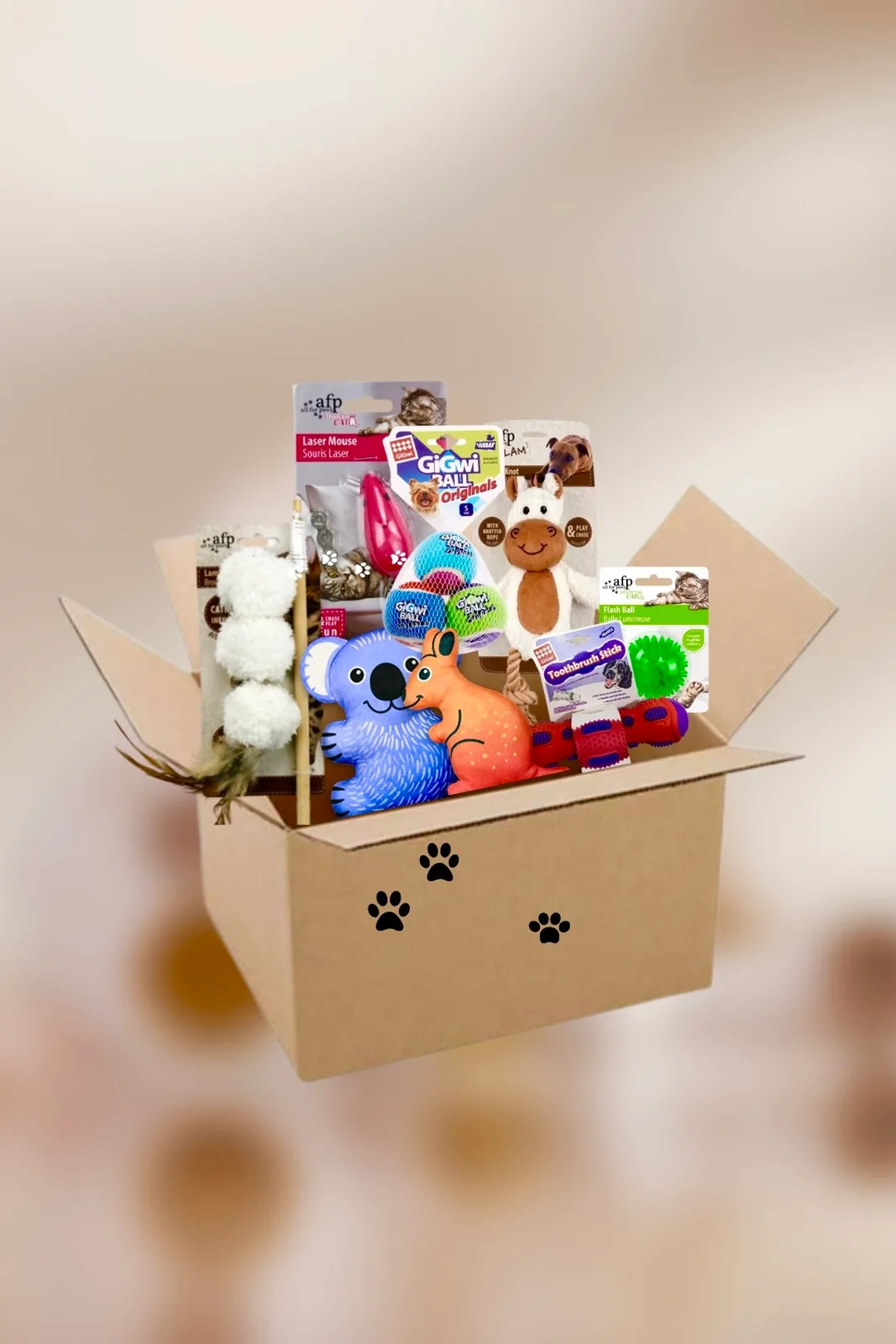 A box filled with assorted cat and dog toys