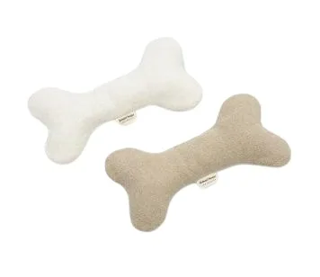 Soft bone-shaped dog toys in cream and tan
