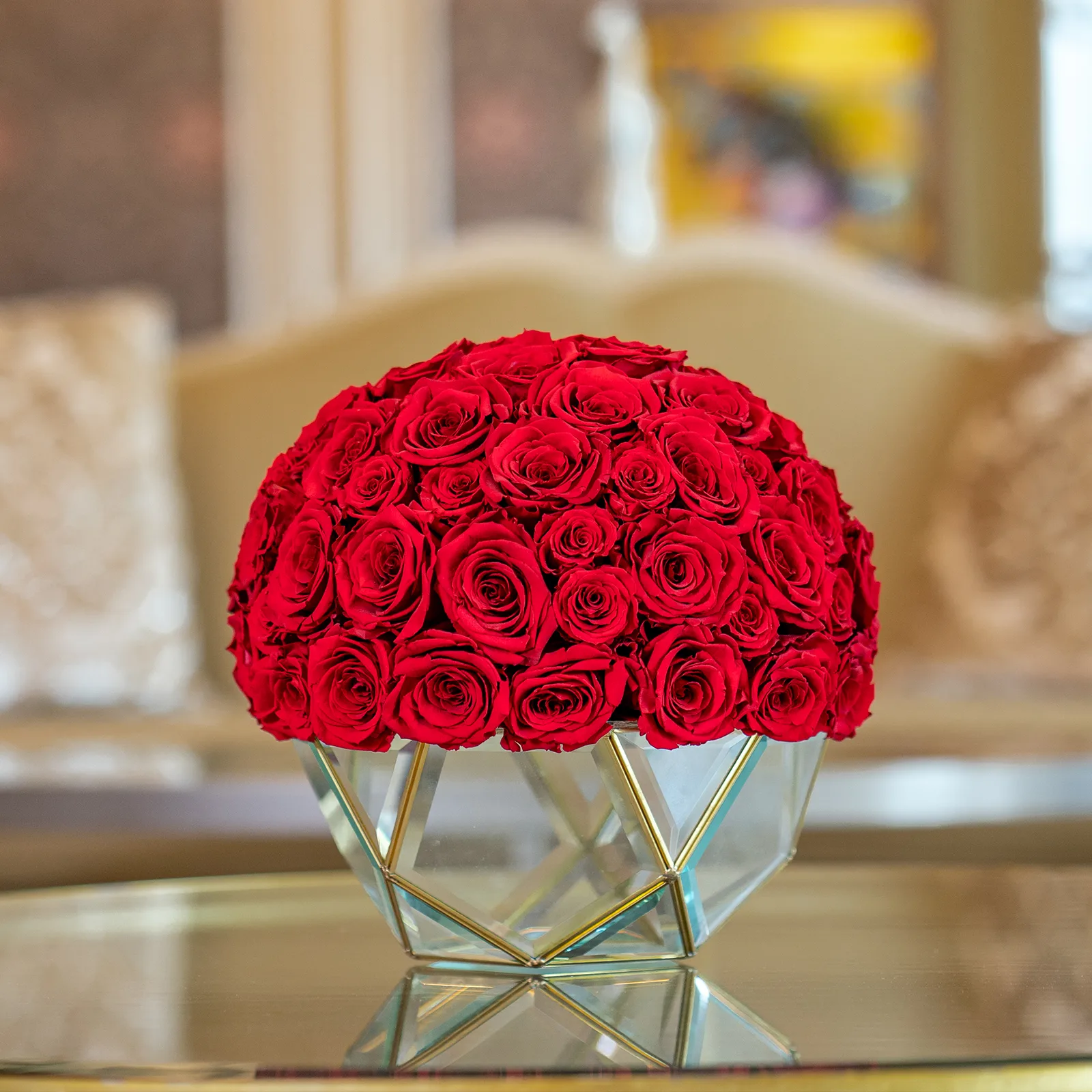 A dome of red preserved roses arranged in a faceted glass bowl at Forever Rose London