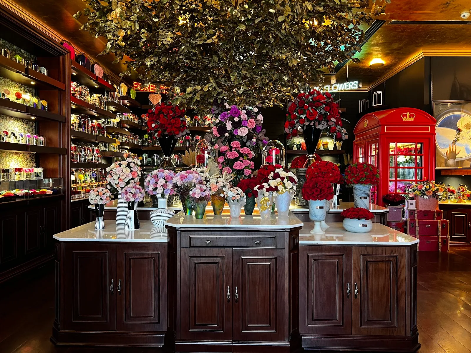 Grand fresh arrangements lining the marble counters of the atelier
