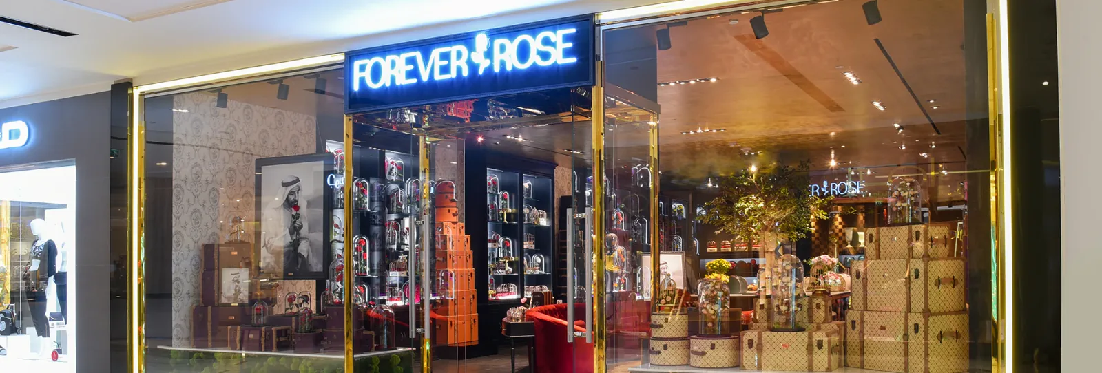 Forever Rose storefront with illuminated signage and trunk displays
