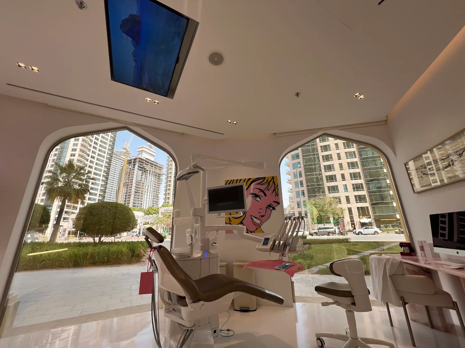 Treatment room with twin arched windows looking onto Jumeirah Beach Residence