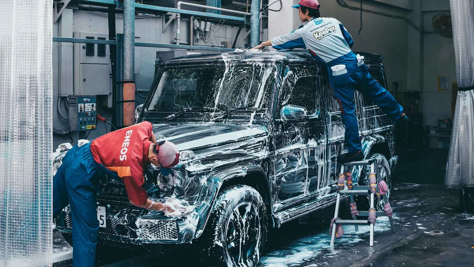 Vehicle covered in foam during a hand wash and detail