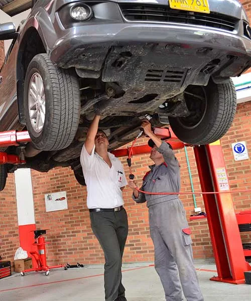 Vehicle on a lift being inspected
