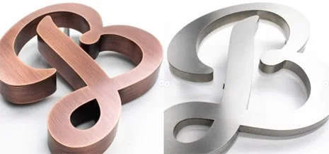 Brushed copper and steel built-up letters