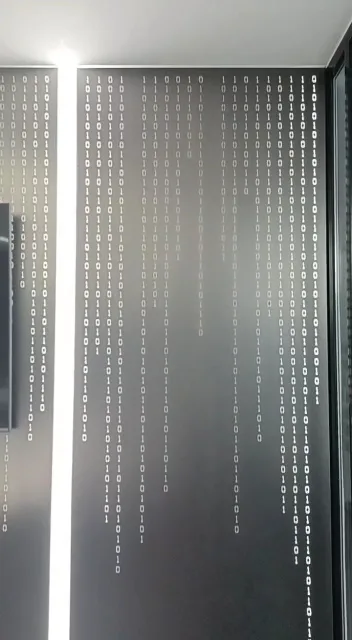 Patterned frosted glass film on an office partition