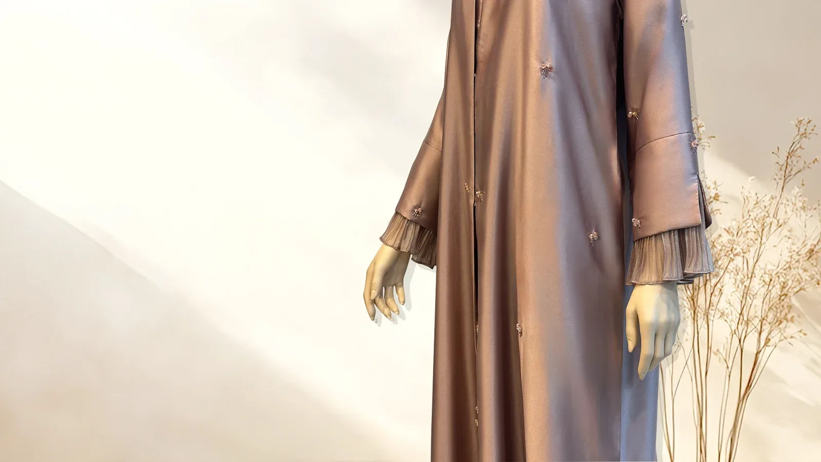 Champagne-gold abaya with raised floral appliqué and a draped shayla