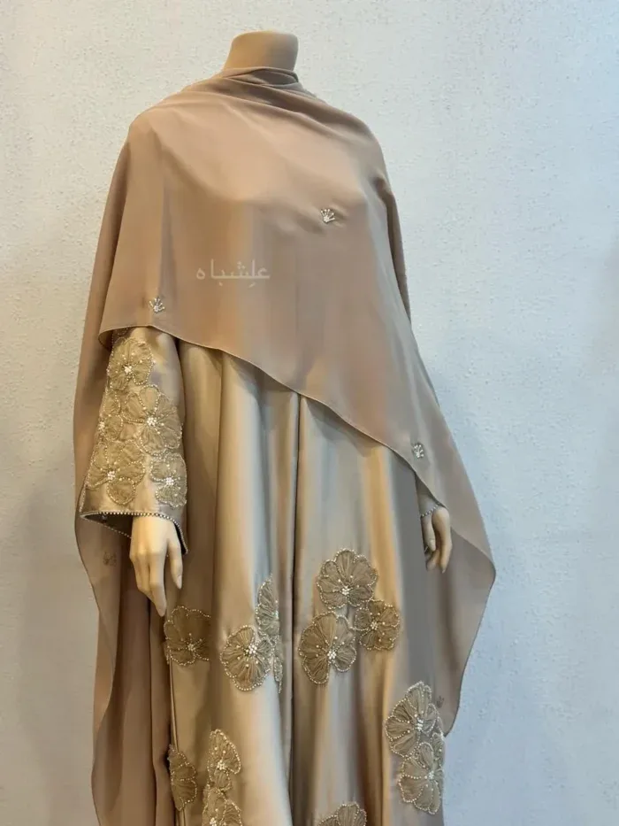 Dusty pink abaya sleeve with pearl-beaded flowers and a tiered cuff