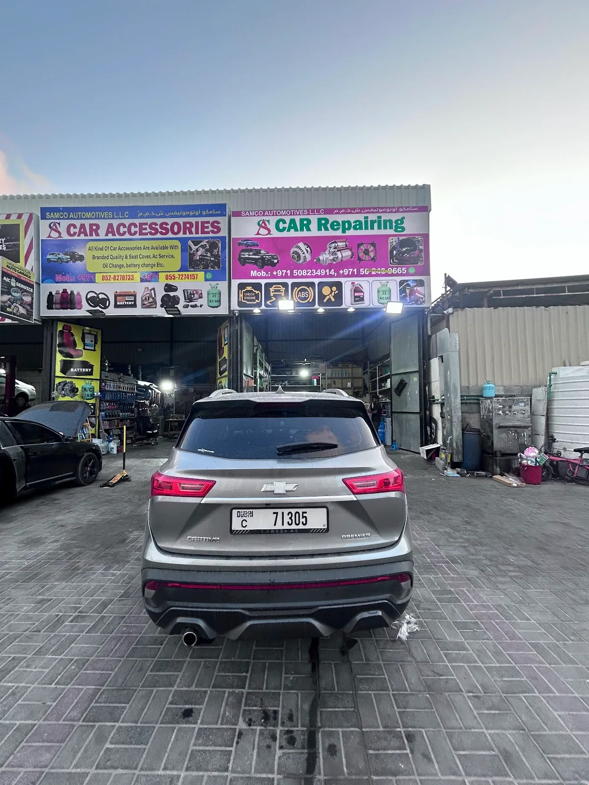 The workshop entrance with a vehicle parked out front in Al Quoz, Dubai