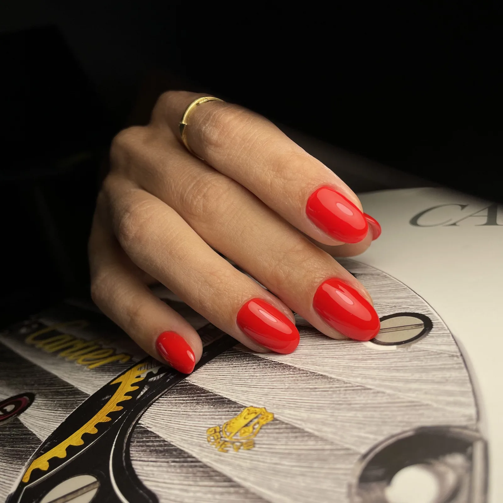 Bold red glossy almond manicure