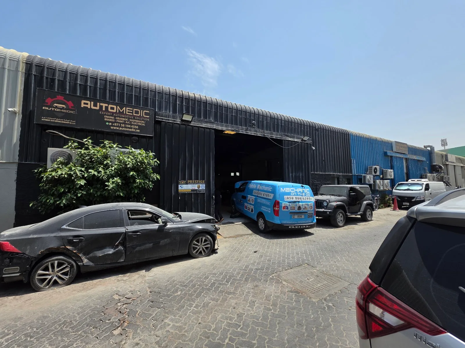 The AutoMedic workshop exterior with signage in Al Quoz, Dubai