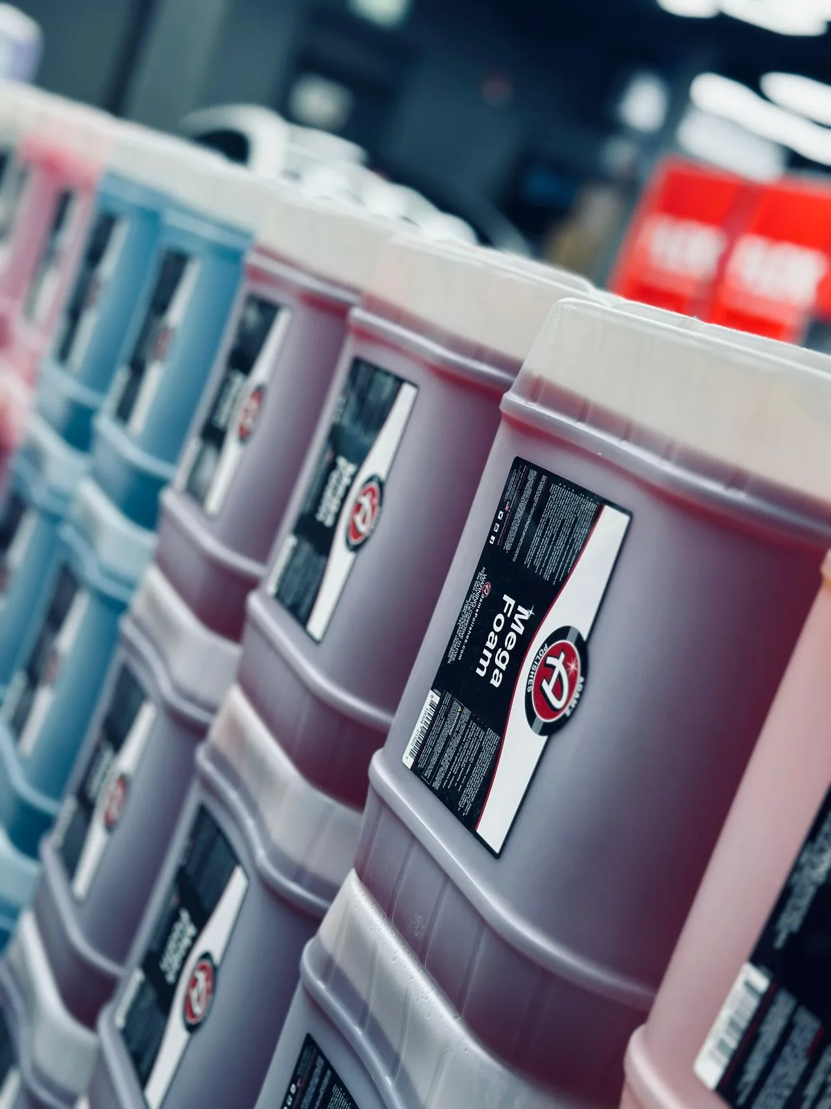 Stacks of Adam's Mega Foam pails ready for wholesale