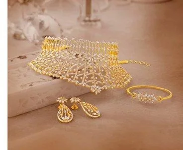 Diamond necklace set with matching bangle and earrings on a light surface