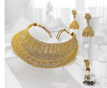 Gold choker necklace set with jhumka earrings and a side pendant