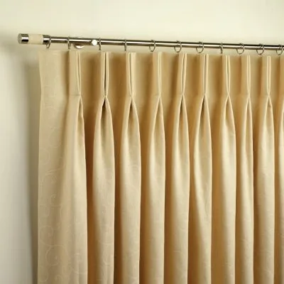 Pinch pleat curtain heading on a rod