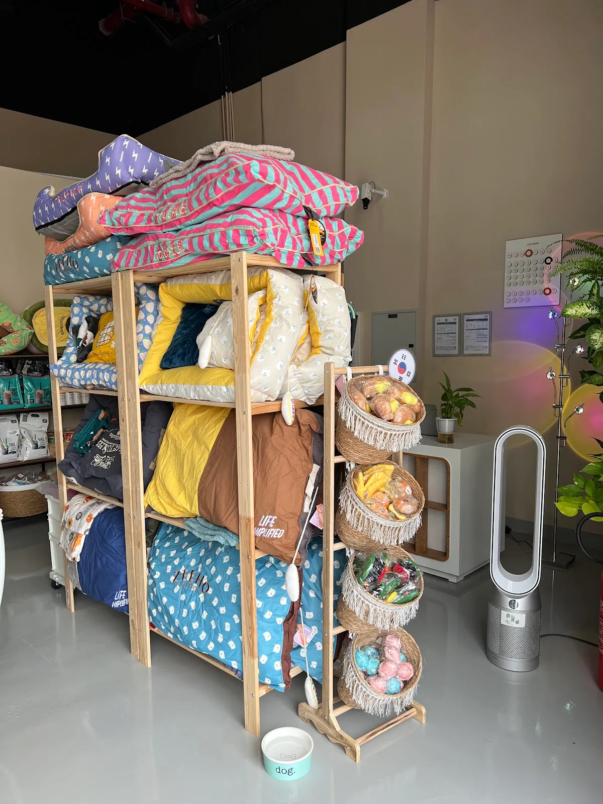Boutique shelves stocked with pet beds and toys