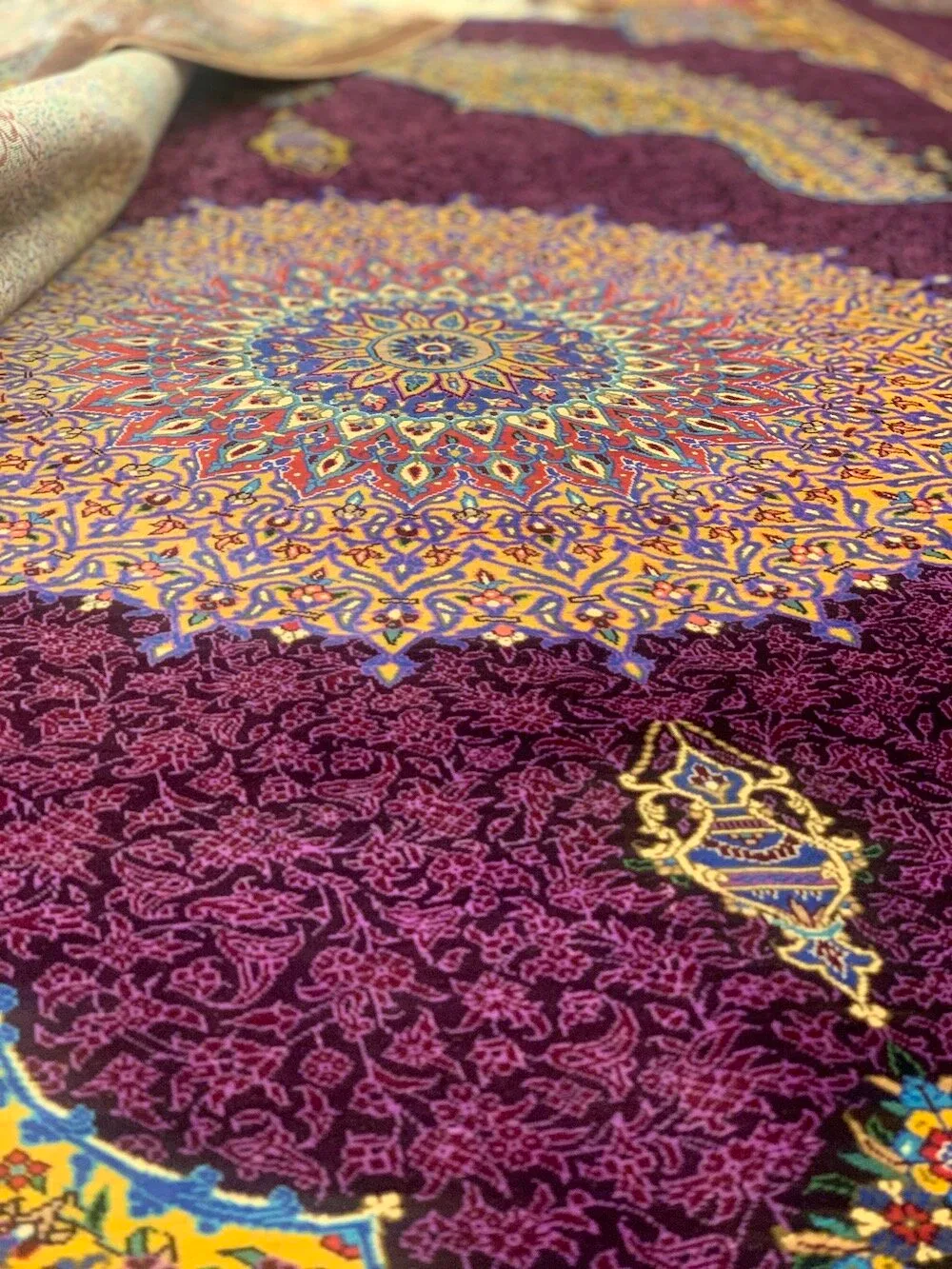 Detail of a purple and gold silk carpet medallion