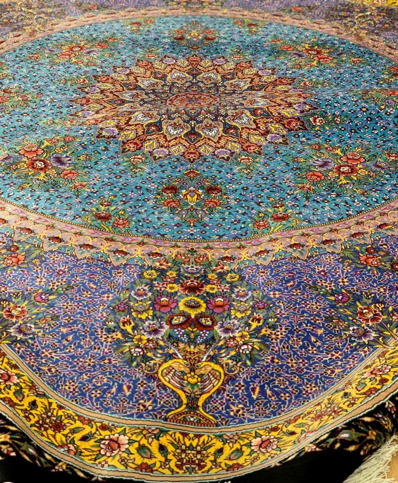 Turquoise silk Persian carpet with a finely detailed star medallion