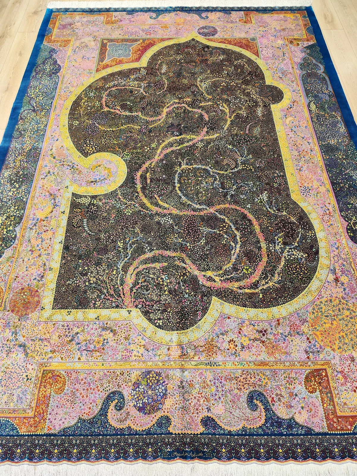 Contemporary silk carpet with a flowing abstract design in soft pastels