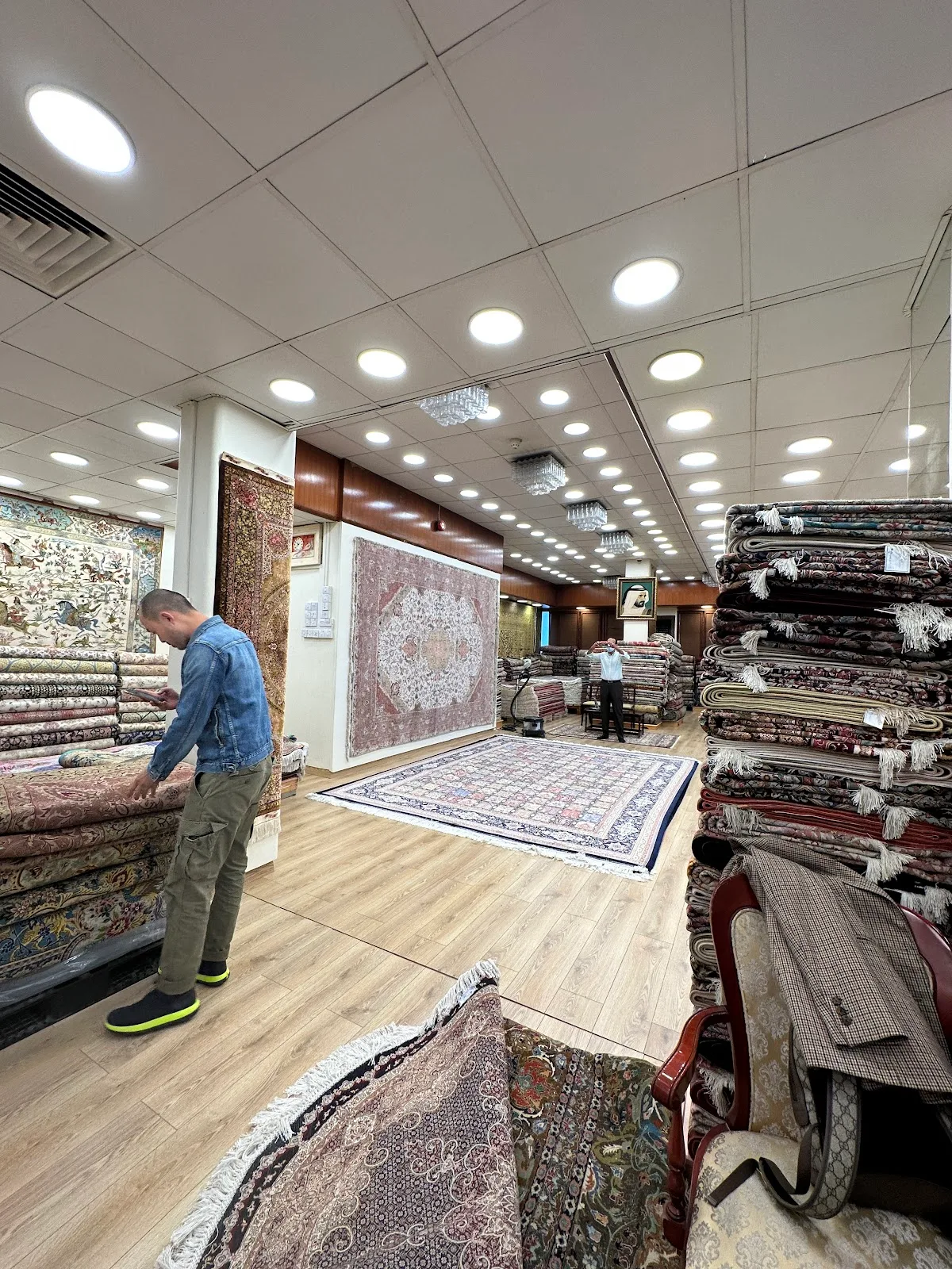 Inside the Farco showroom with stacks of rolled carpets