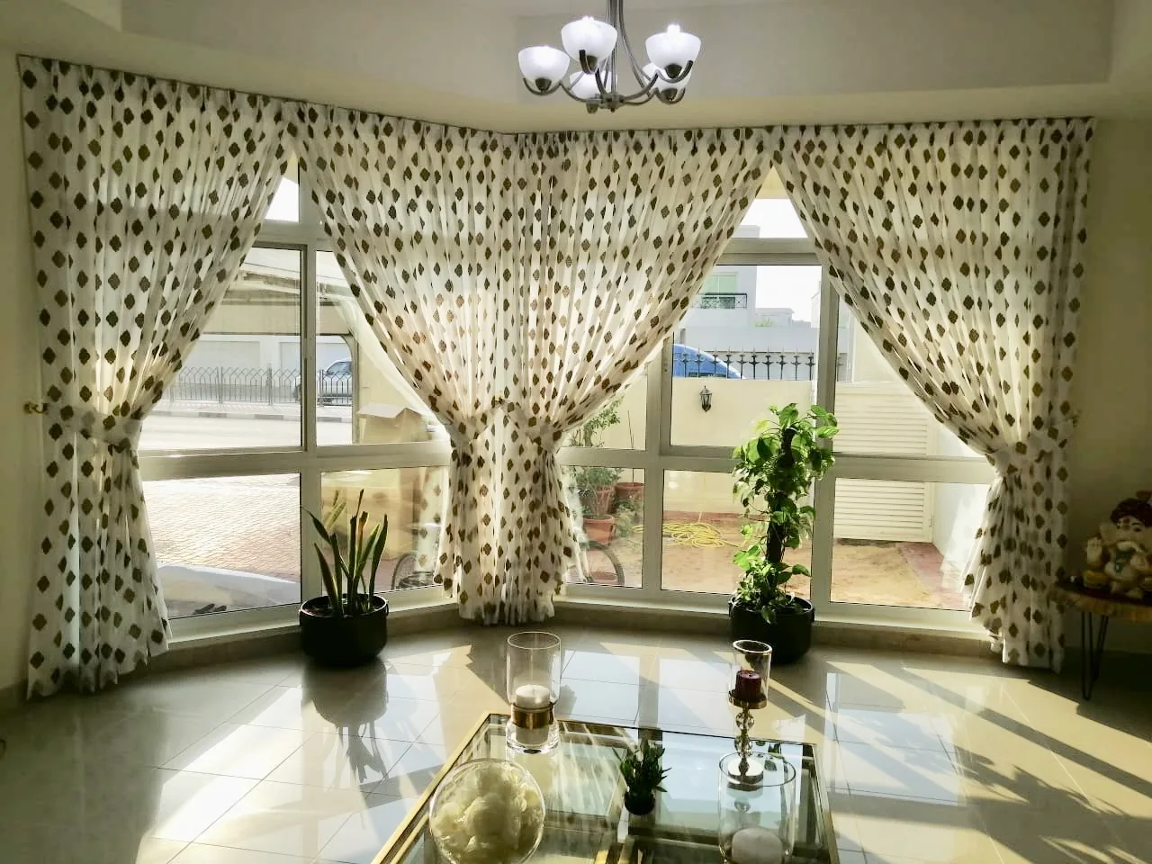 Patterned sheers framing a bay window