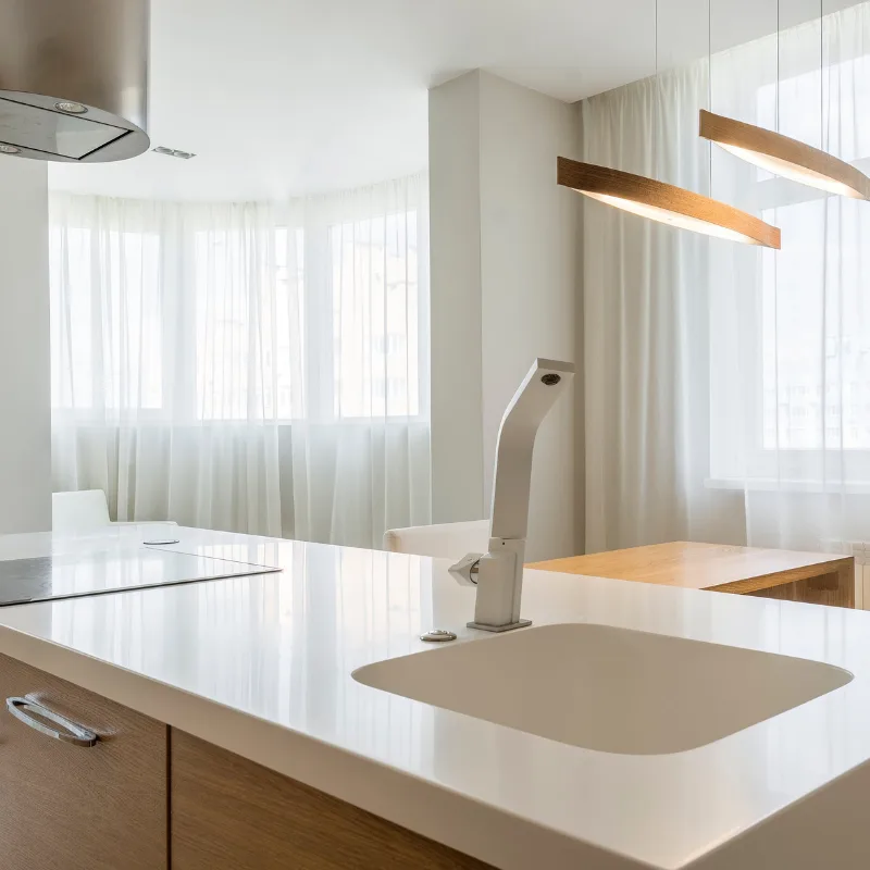 White kitchen with sheer curtains