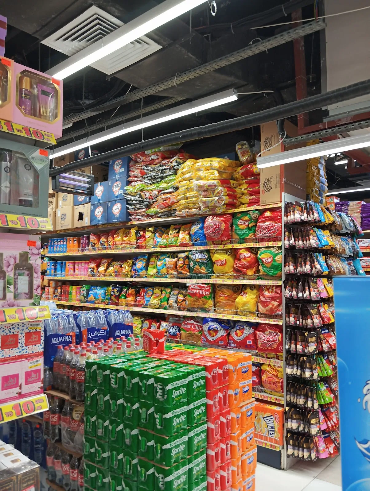 Shelves of chips, biscuits and soft drinks at Gifts Village