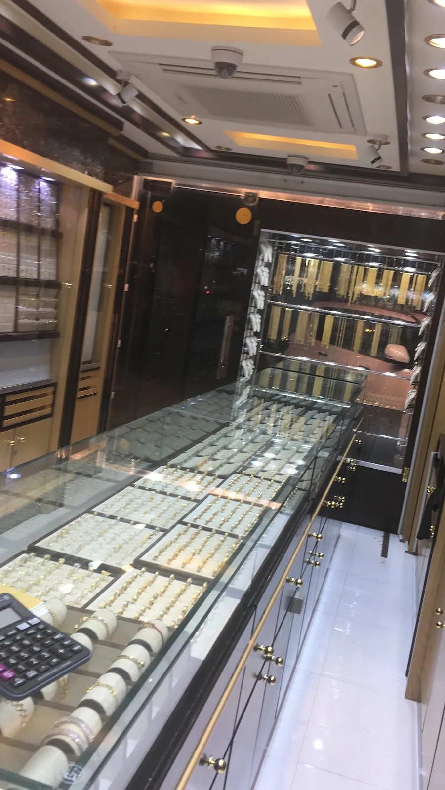 Gold rings and chains on display inside the Red Rose Jewellery showroom in Al Satwa, Dubai