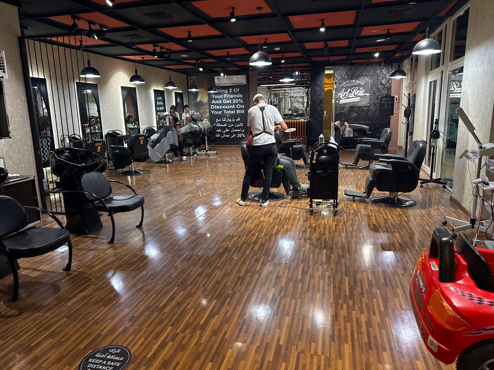 Wide view of the ArtLine salon floor with styling chairs