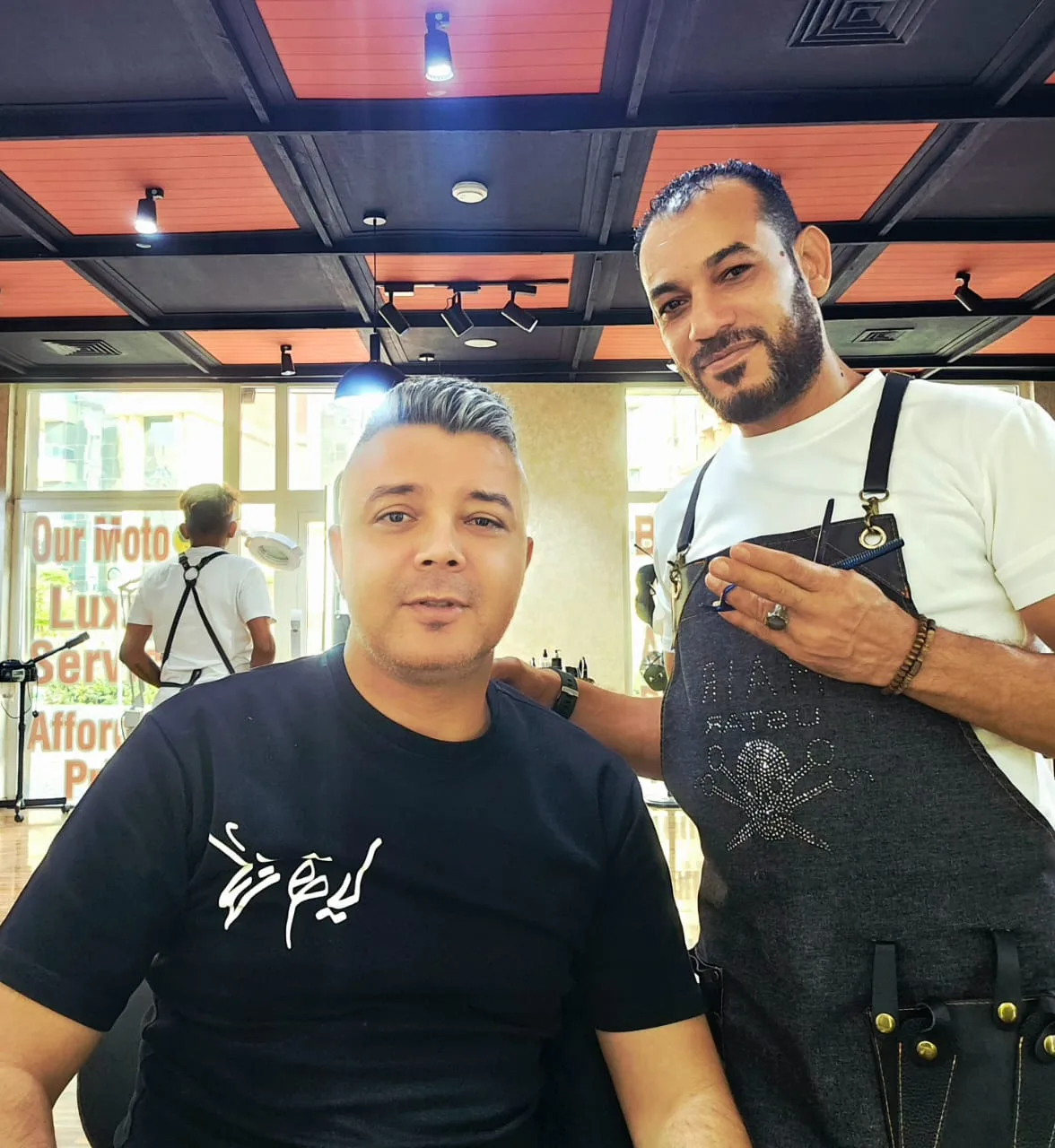 A happy client with an ArtLine barber after a haircut