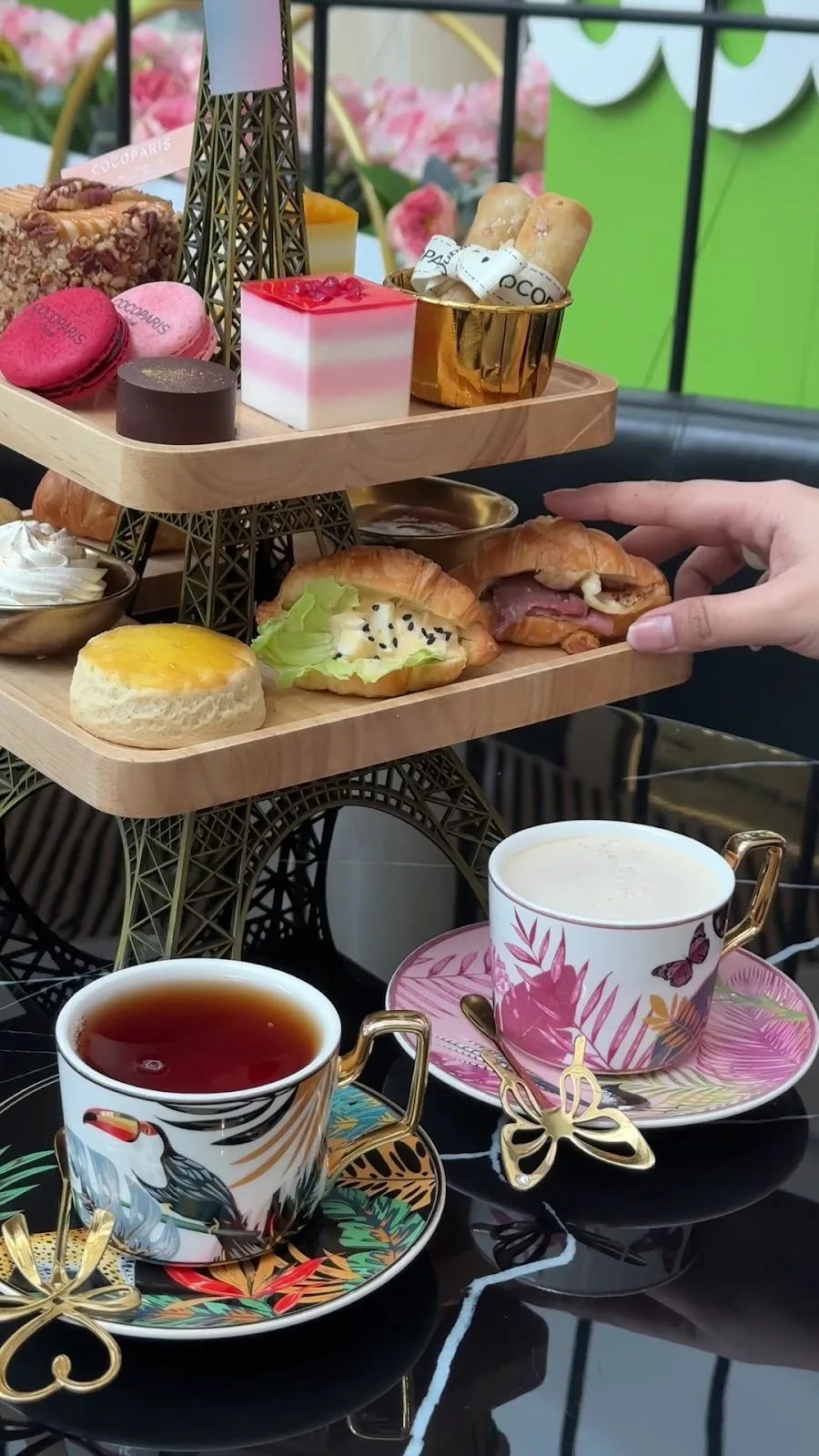 Eiffel-tower afternoon tea tier with macarons, scones and patisserie