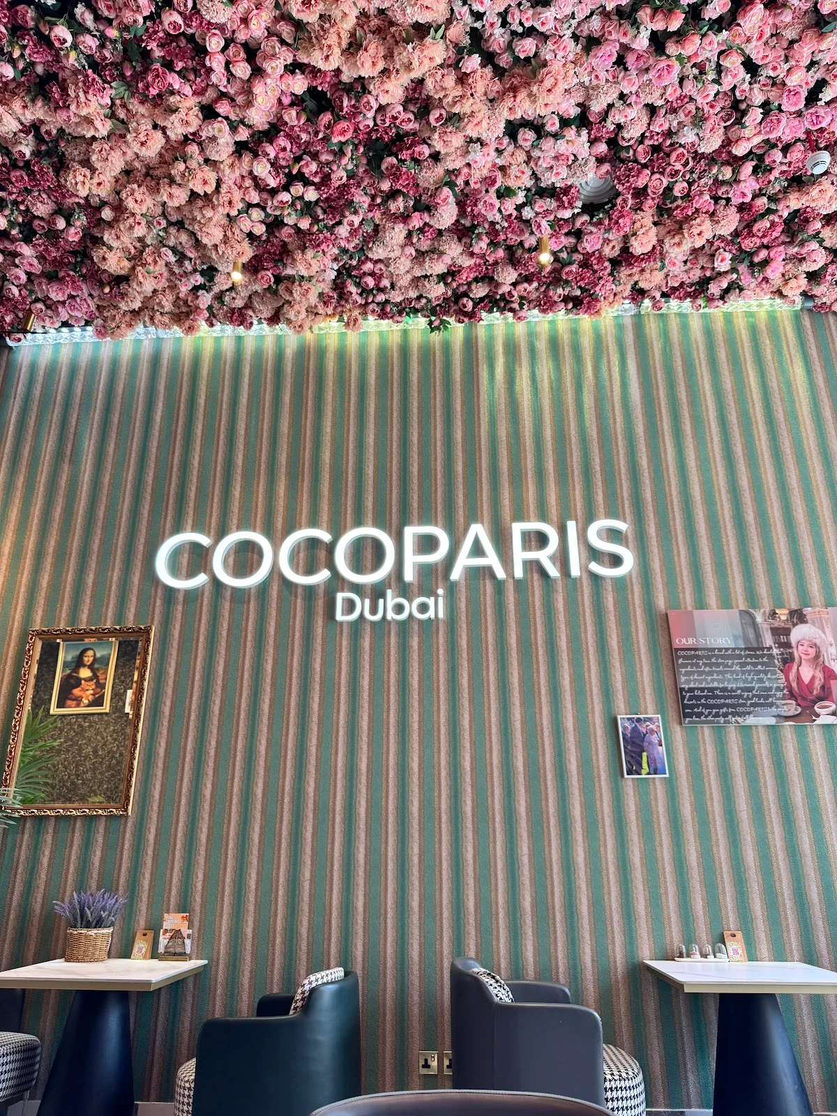 COCOPARIS Dubai neon wordmark on the striped wall