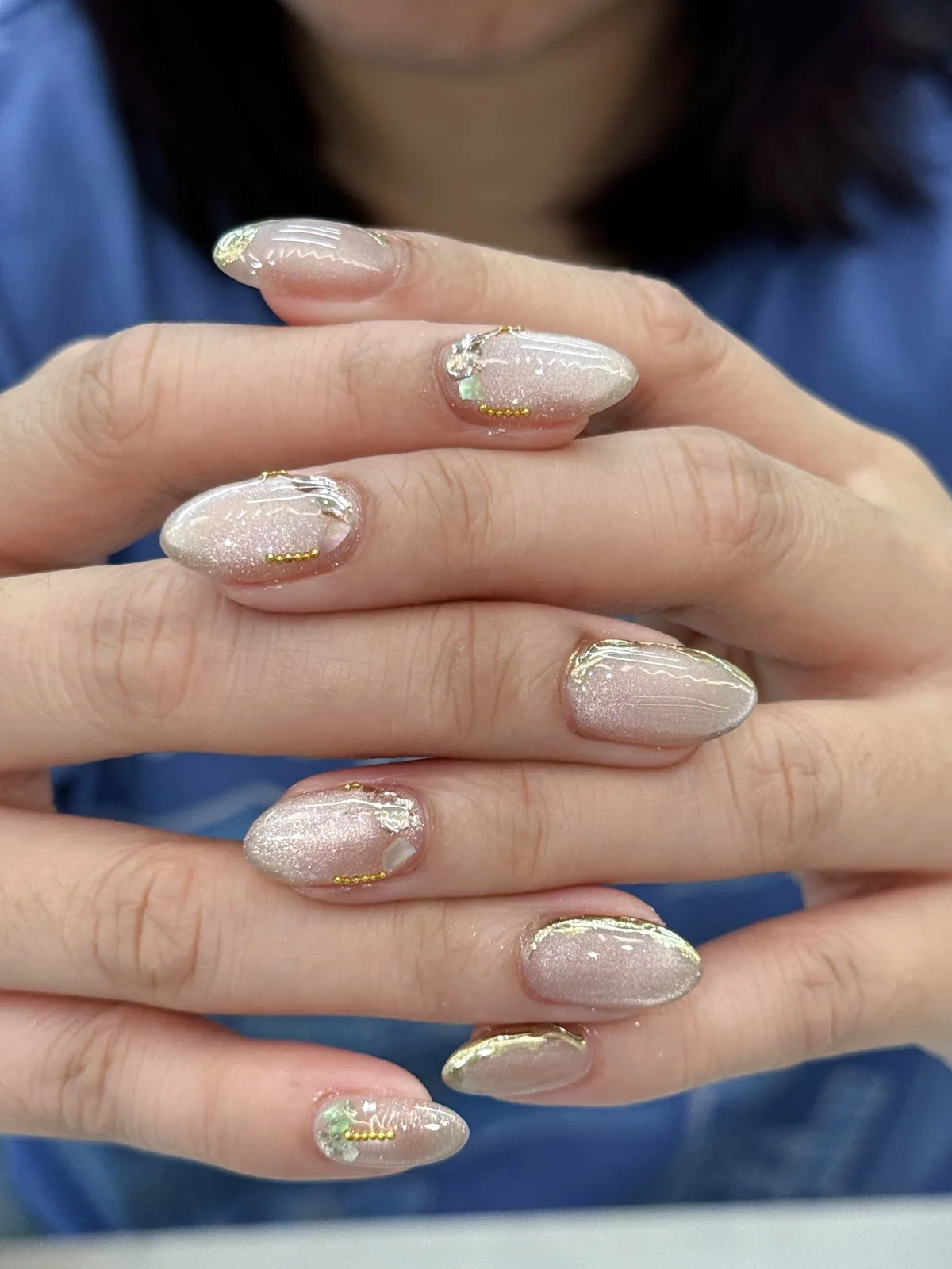 Shimmer cat-eye gel nails finished at the studio