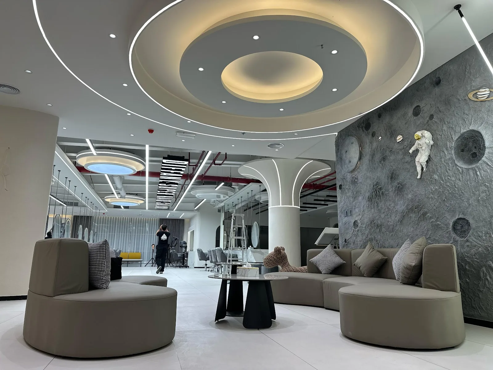 Space-themed relaxation lounge with astronaut wall