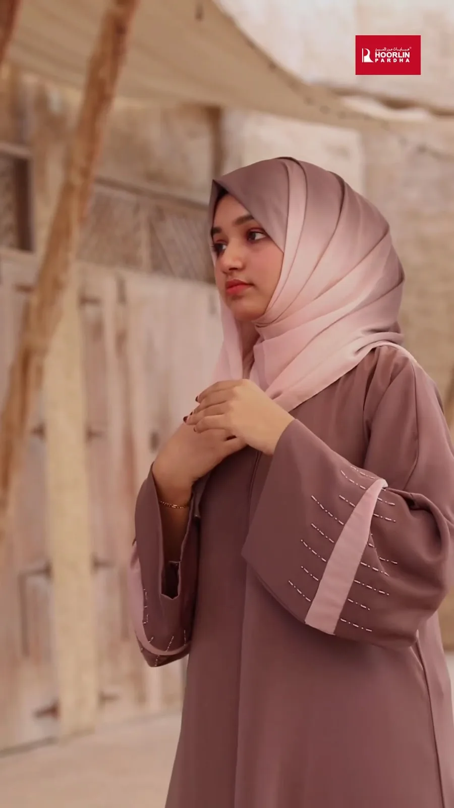 Model in a soft pink ombre hijab and mauve abaya