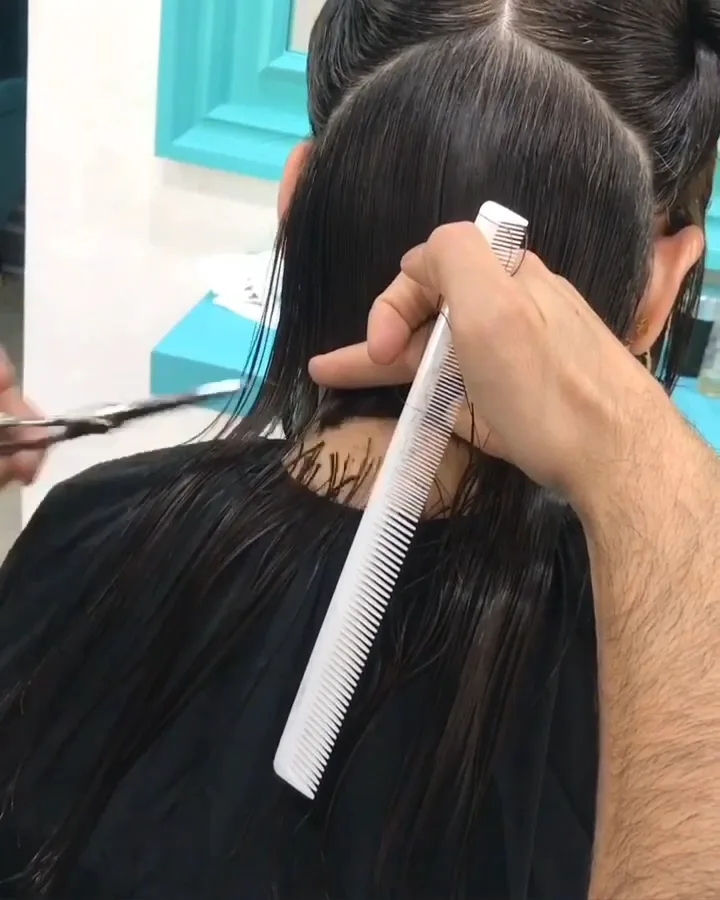 Precision haircut being shaped at the salon