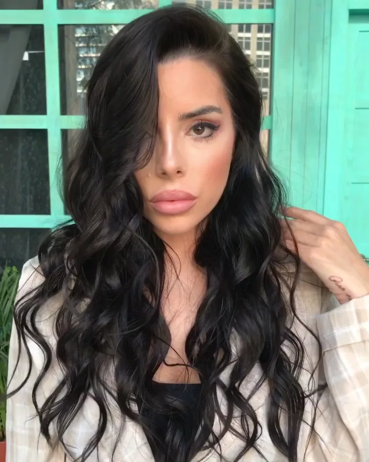 Glossy bombshell curls styled for an occasion