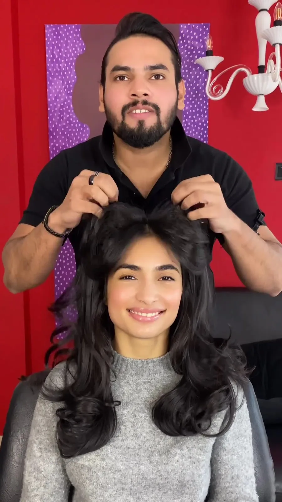 Stylist creating volume during a session at The S