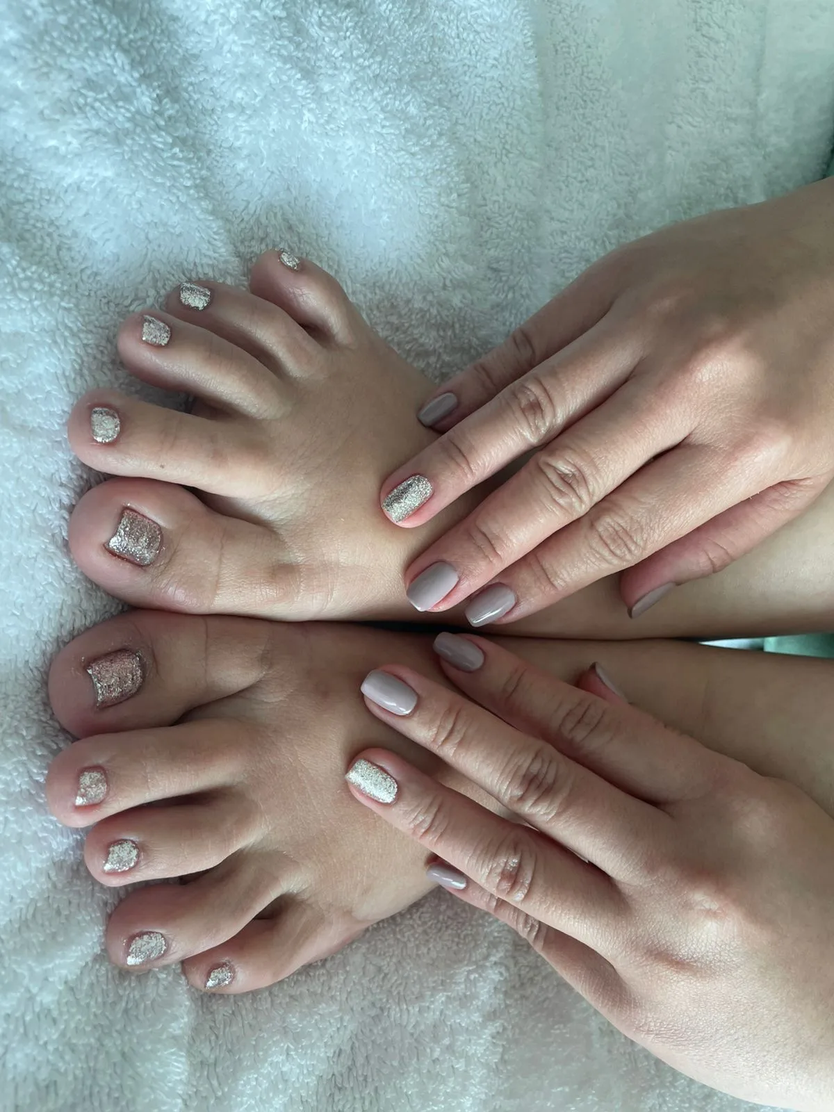 Matching silver glitter manicure and pedicure