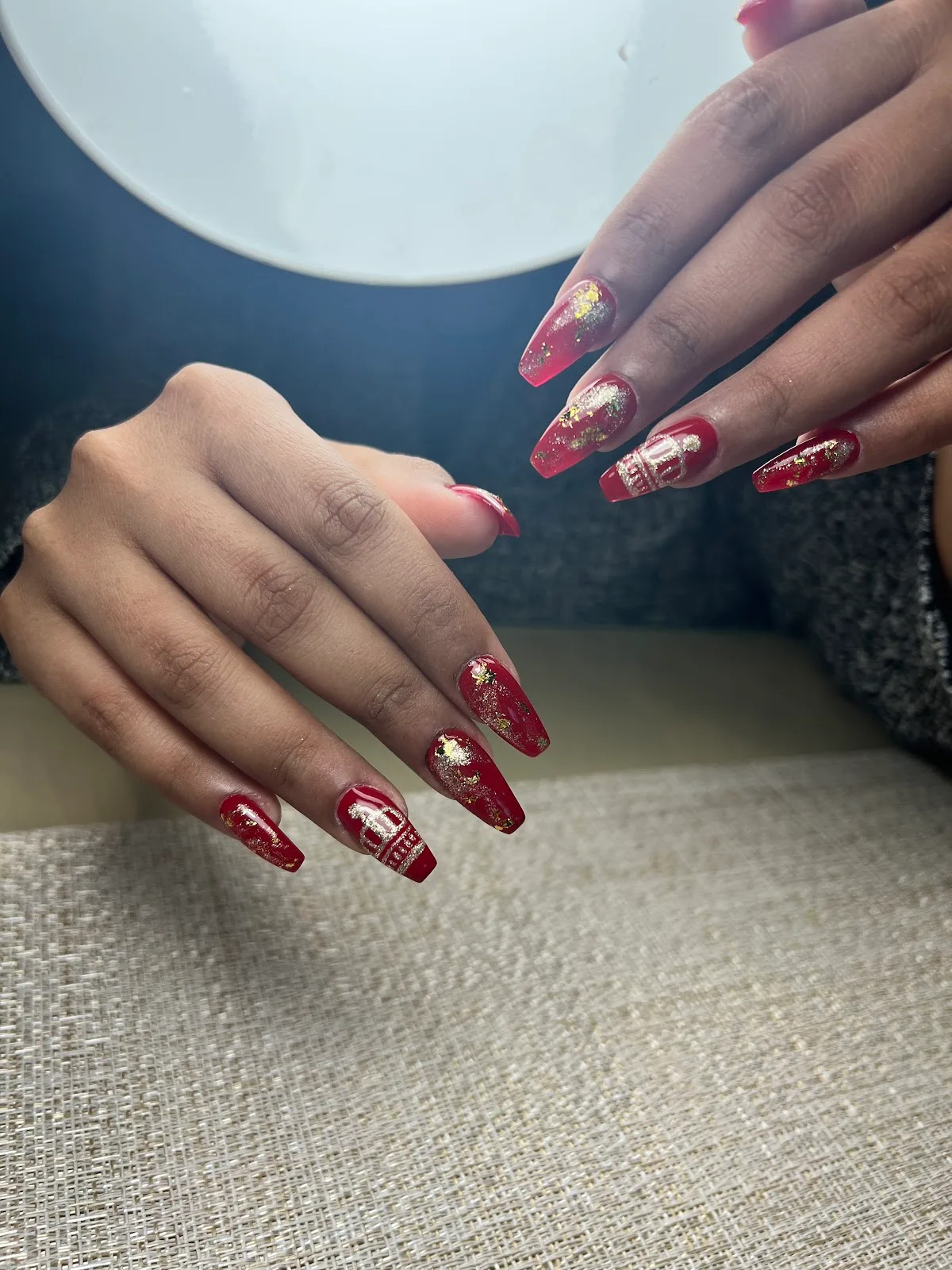 Red and gold festive long nails with foil detail