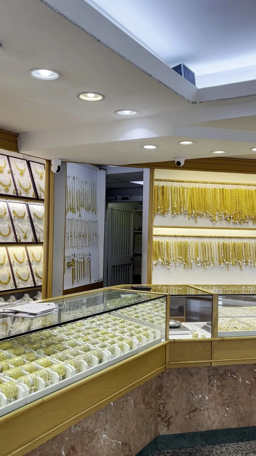 Interior of Chittilappilly Jewellers with gold bangles, necklaces and display counters