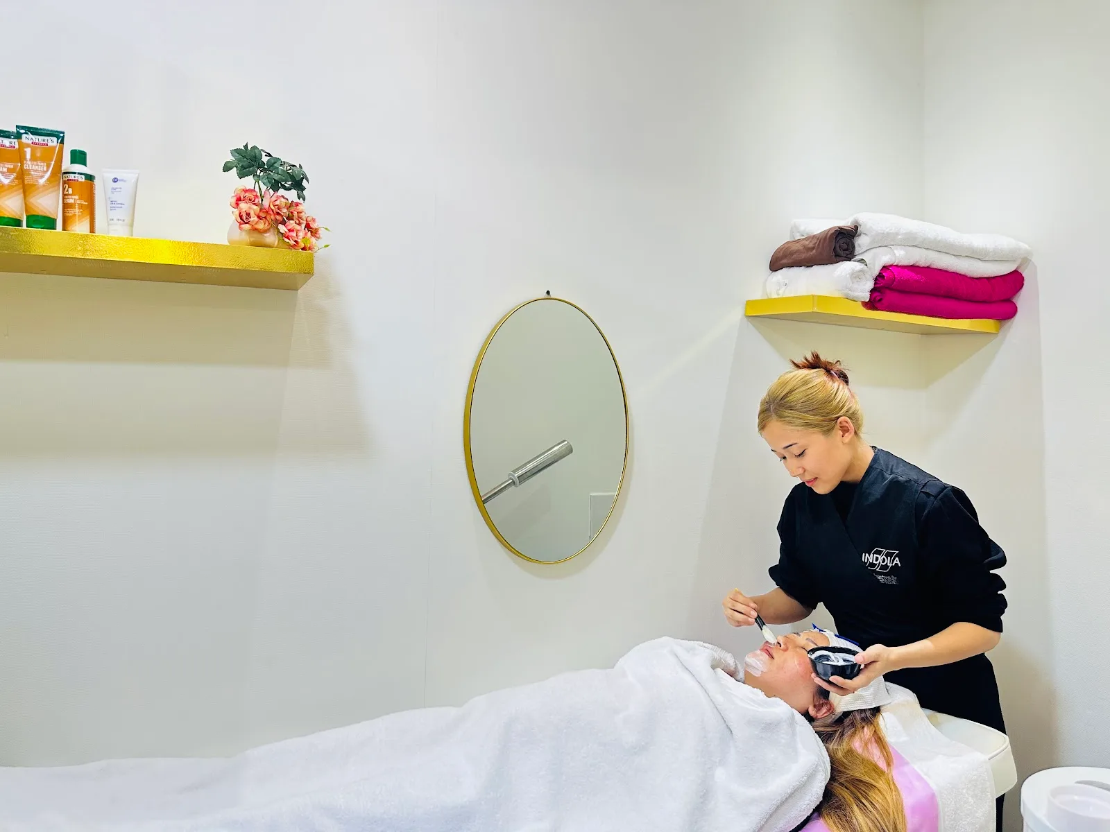Facial treatment in the salon's skincare room