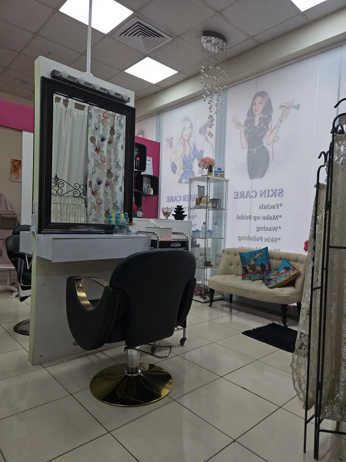 A styling chair, mirror and seating area inside Impression Ladies Salon