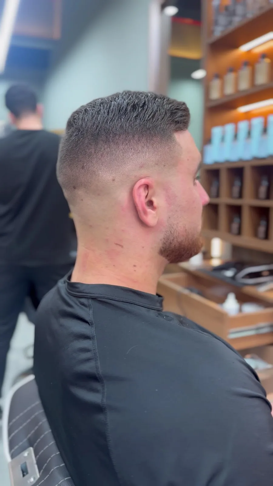 Back view of a short crop with a high skin fade